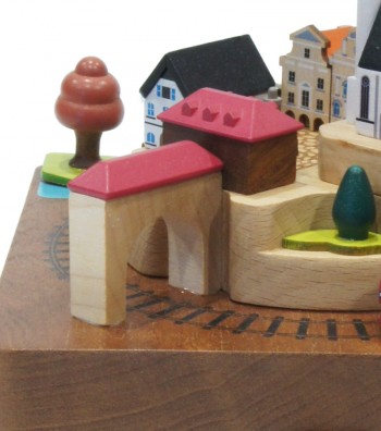 Wooden music box train and colorful houses